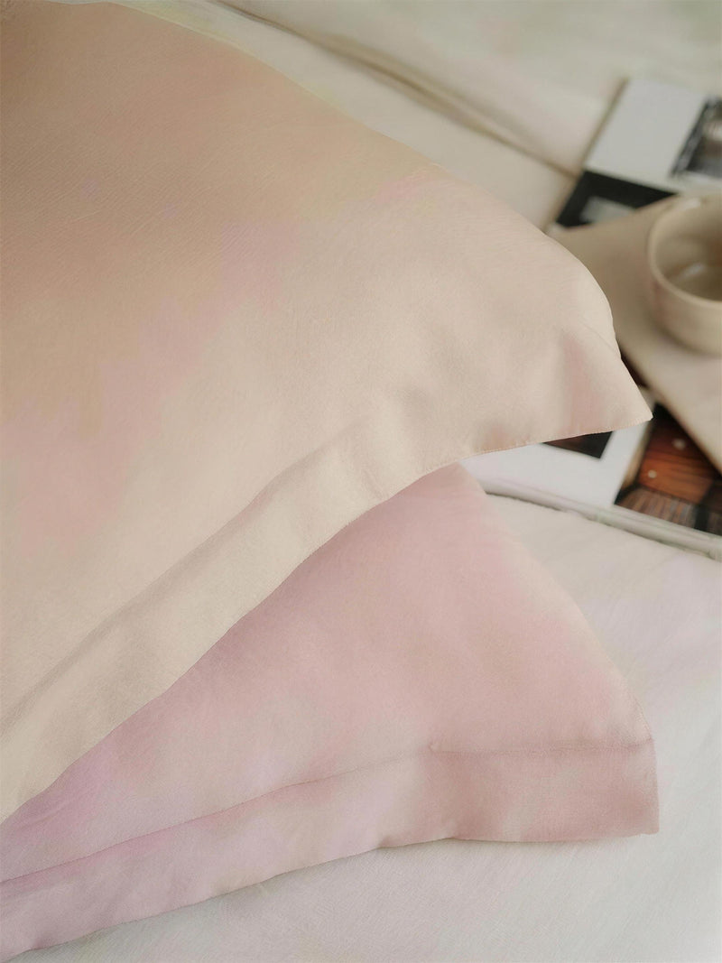 Blush double-face two-tone cushion covers, styled at home