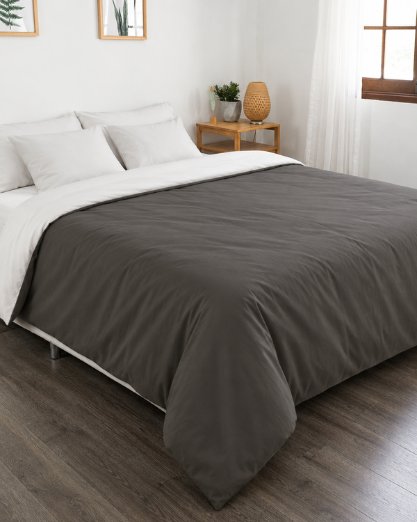 Charcoal Grey duvet cover with off white reverse, off white fitted sheet and off white pillowcases in Plain Cotton