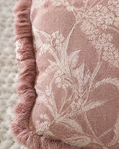 Close-up of dusty rose floral jacquard with fringed edge