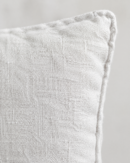Close-up of white enzyme-washed slub fabric and self piping