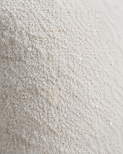 Close-up of ivory nubby jacquard wool