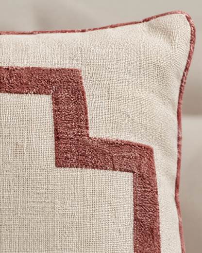 Macro close-up of the ivory and rose embroidery, a soft chenille-like rose frame band on oat linen with rose piping