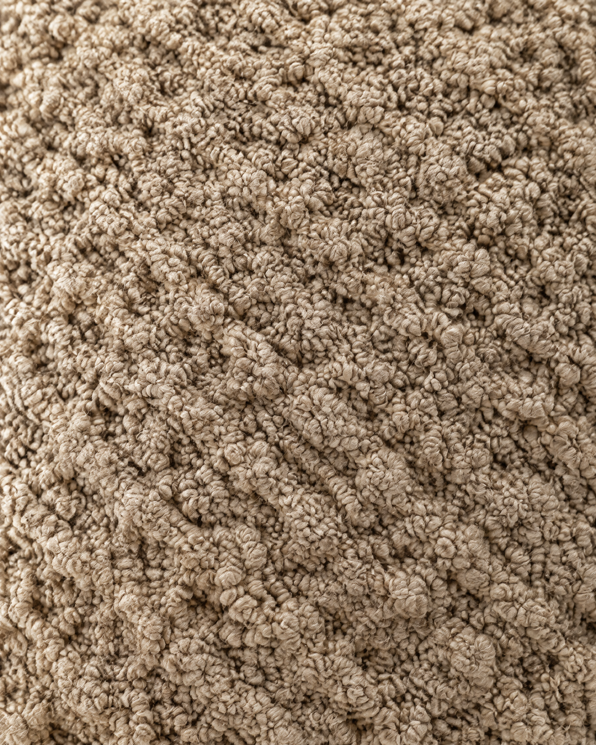 Close-up of natural jute knotted into a raised honeycomb relief