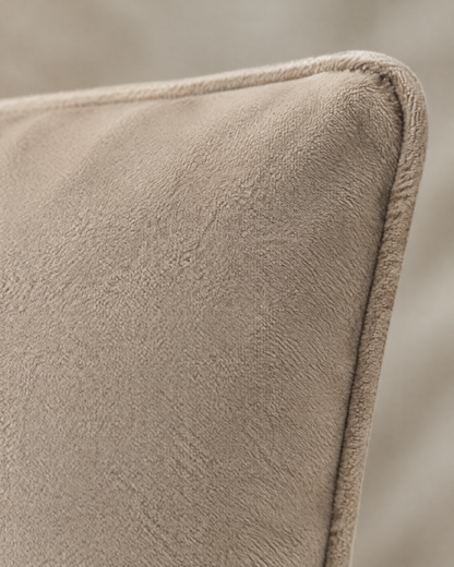 Close-up of oat soft-touch fabric with piped edge
