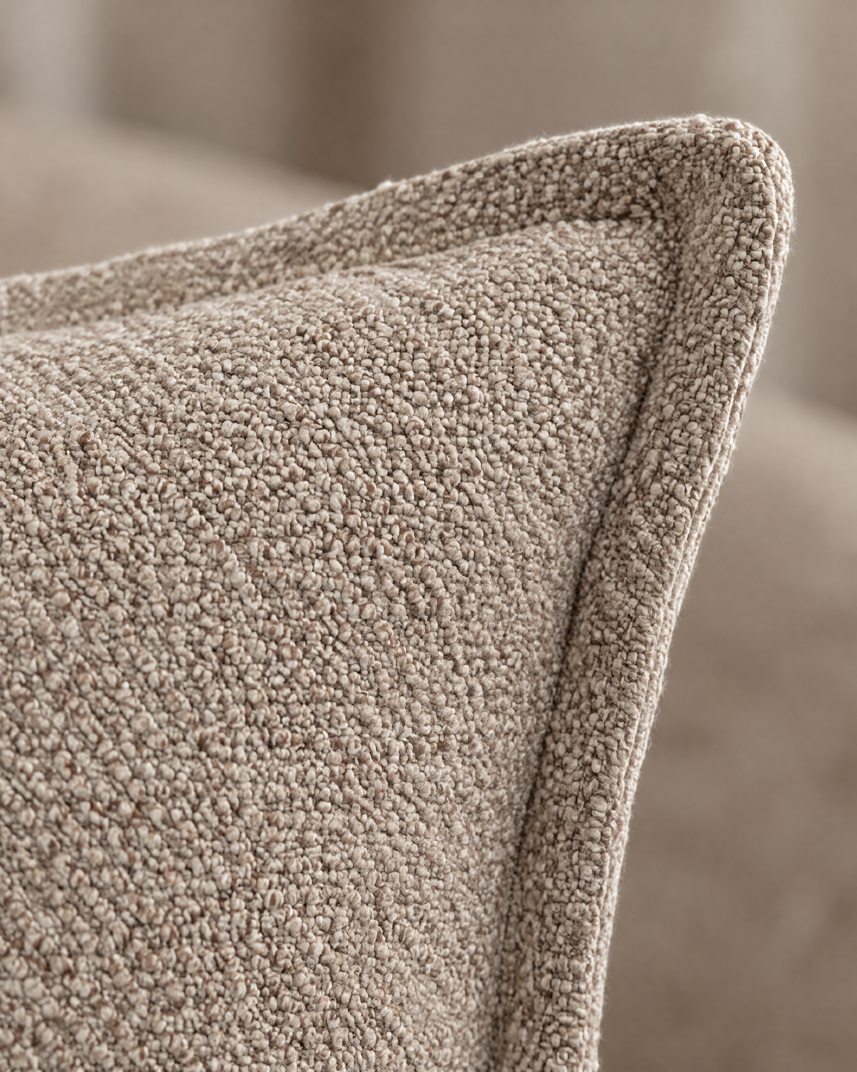 Macro close-up of the taupe heathered jacquard, a nubby mix of taupe, cream and brown yarns with the flange
