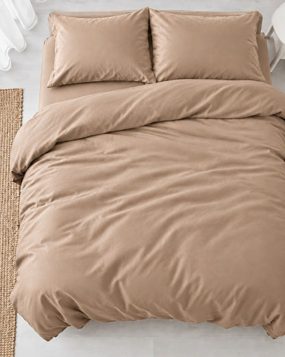 Overhead view of a Light Beige silky cotton duvet cover, beige cotton sateen, with two matching pillows on a made bed