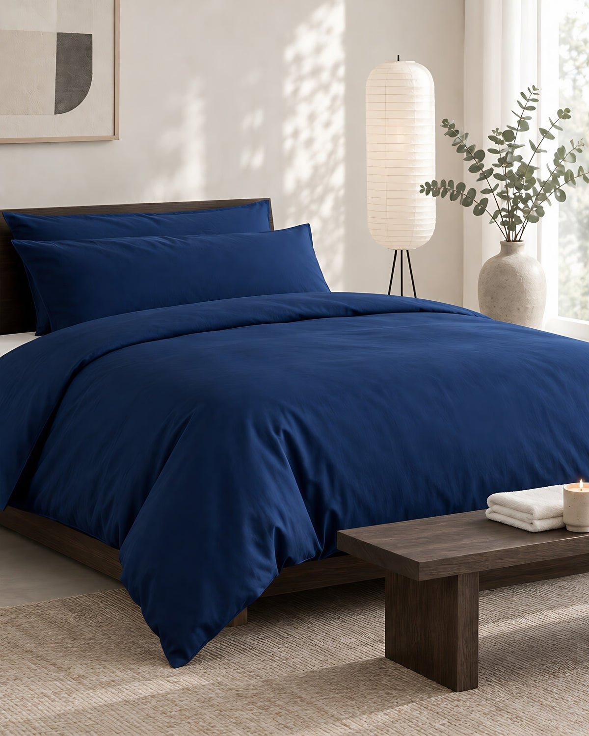 Marine Blue silky cotton duvet cover in a calm Japandi bedroom on a low dark-oak bed