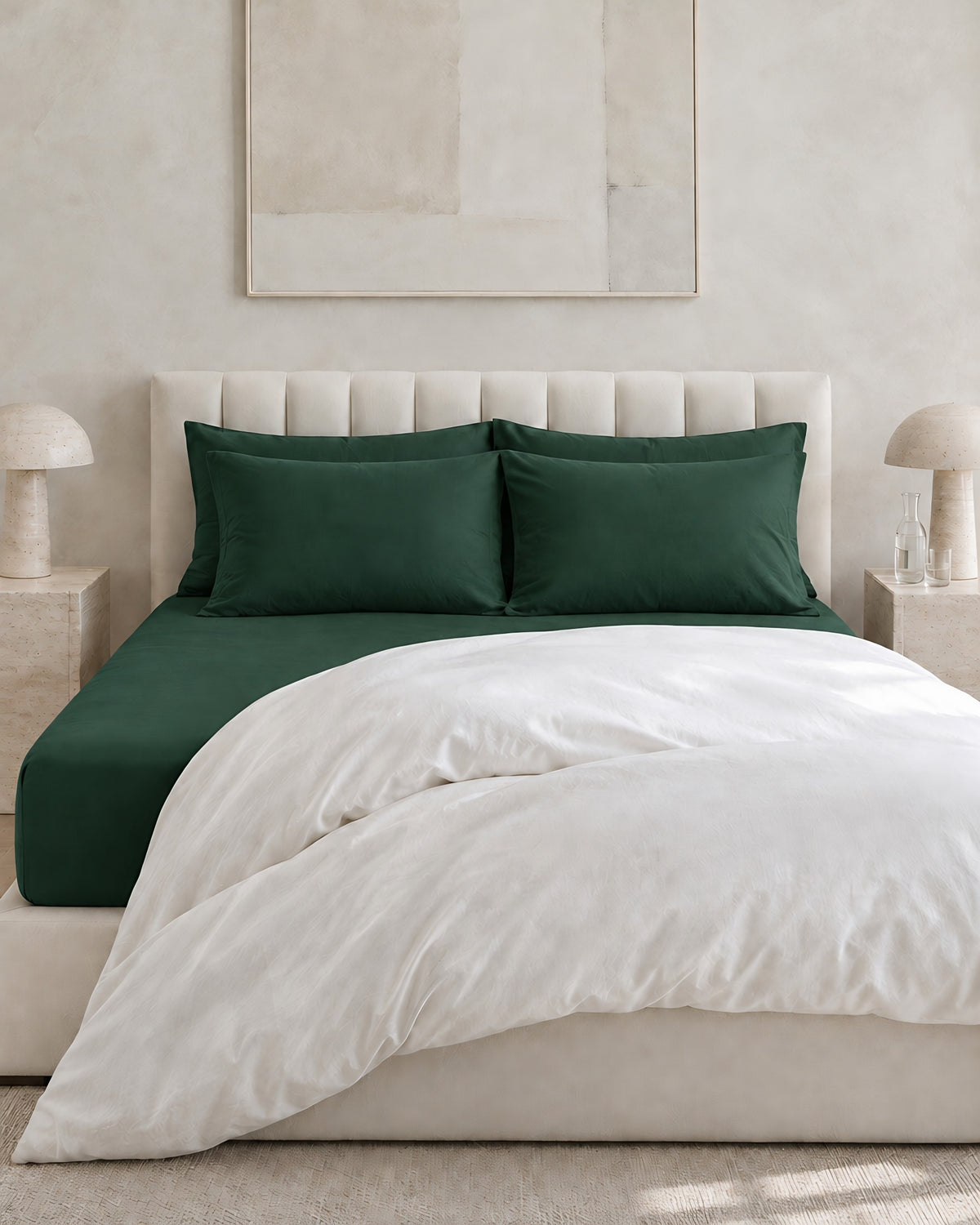 Forest Green plain cotton fitted sheet and pillowcases in bottle green under a white duvet