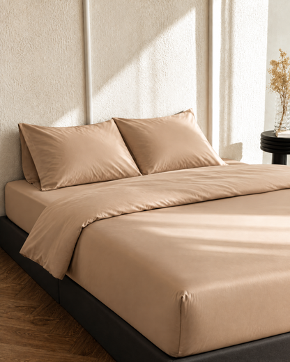 Light Beige silky cotton fitted sheet on a mattress, corner visible