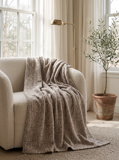 Fawn Alpaca Wool Blend Knit Throw over a boucle armchair by a window