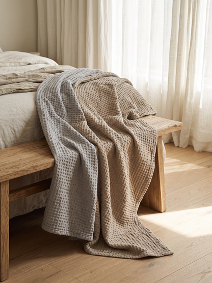 Waffle Weave Viscose Cotton Blanket draped over a bench at the end of a bed