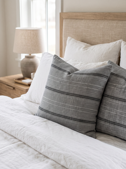 Grey Stripe Jacquard Hemp Cotton Cushion Covers on a made bed