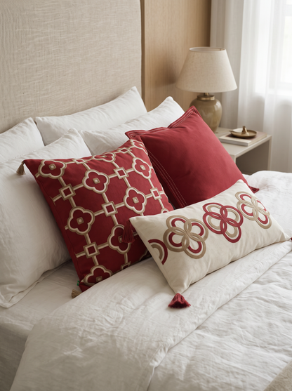 Burgundy Border Embroidery Ramie Cotton Cushion Covers on a made bed