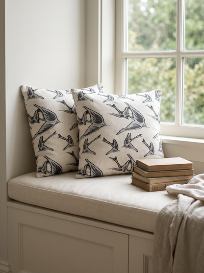 Ivory & Black Swallow Jacquard Cotton Cushion Covers on a window seat