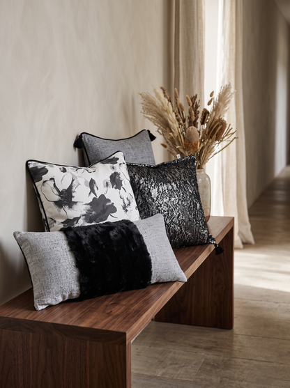 Grey Bouclé Cushion Covers on a walnut bench