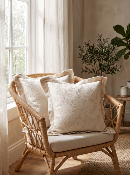 Cream Vine Flanged Jacquard Cotton Viscose Cushion Covers, styled at home on a rattan armchair by a window