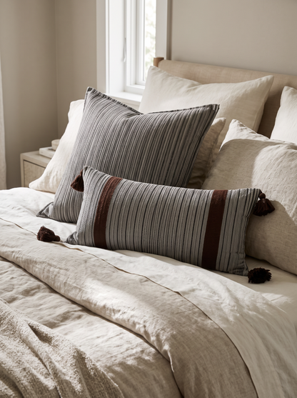 Stripe Tassel Cotton Cushion Covers, Grey Stripe square with Grey & Burgundy lumbar, styled at home on a made bed