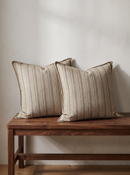 Stripe Flanged Linen Cushion Covers in Natural Stripe, styled at home on a walnut bench