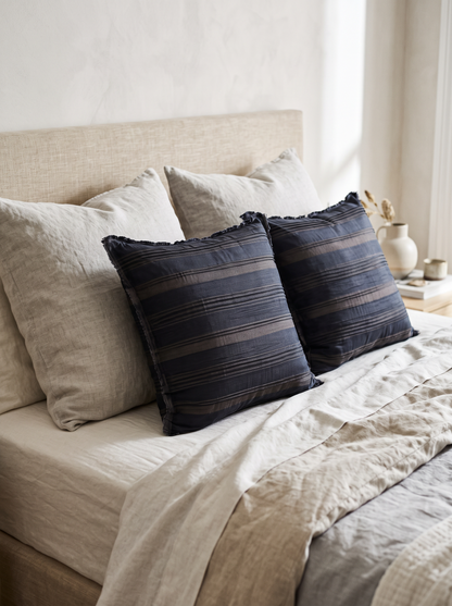 Fringed Stripe Linen Viscose Cushion Covers in Navy & Brown, styled at home on a made bed