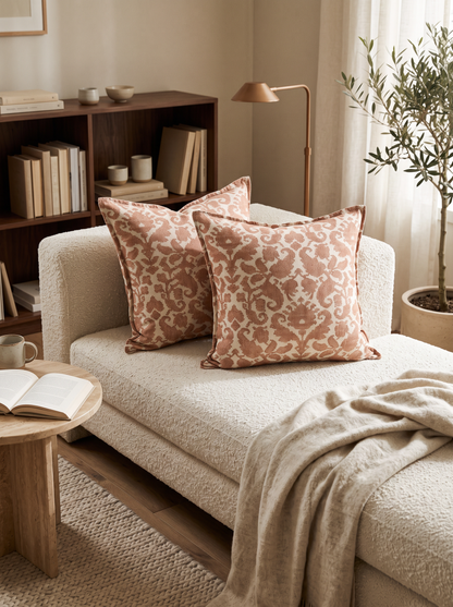 Ivory & Terracotta Printed Cushion Covers in Terracotta Damask, styled at home on a bouclé daybed