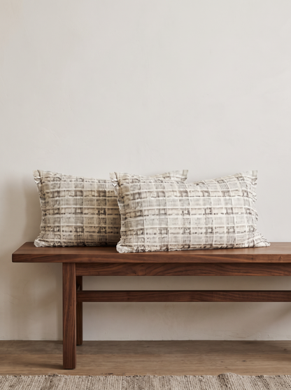 Rose & Ivory Tweed and Bouclé Cushion Covers in Ivory Tweed Lumbar, styled at home on a walnut bench