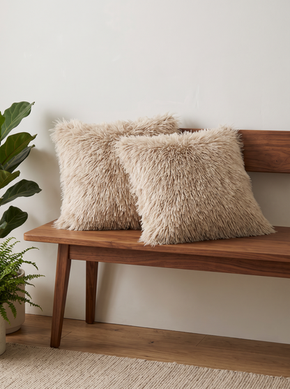 Shaggy Faux Fur Cushion Covers in Sand, styled at home on a walnut bench