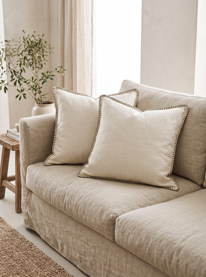 Herringbone Cotton Linen Cushion Covers in Diamond White, styled at home on a linen sofa