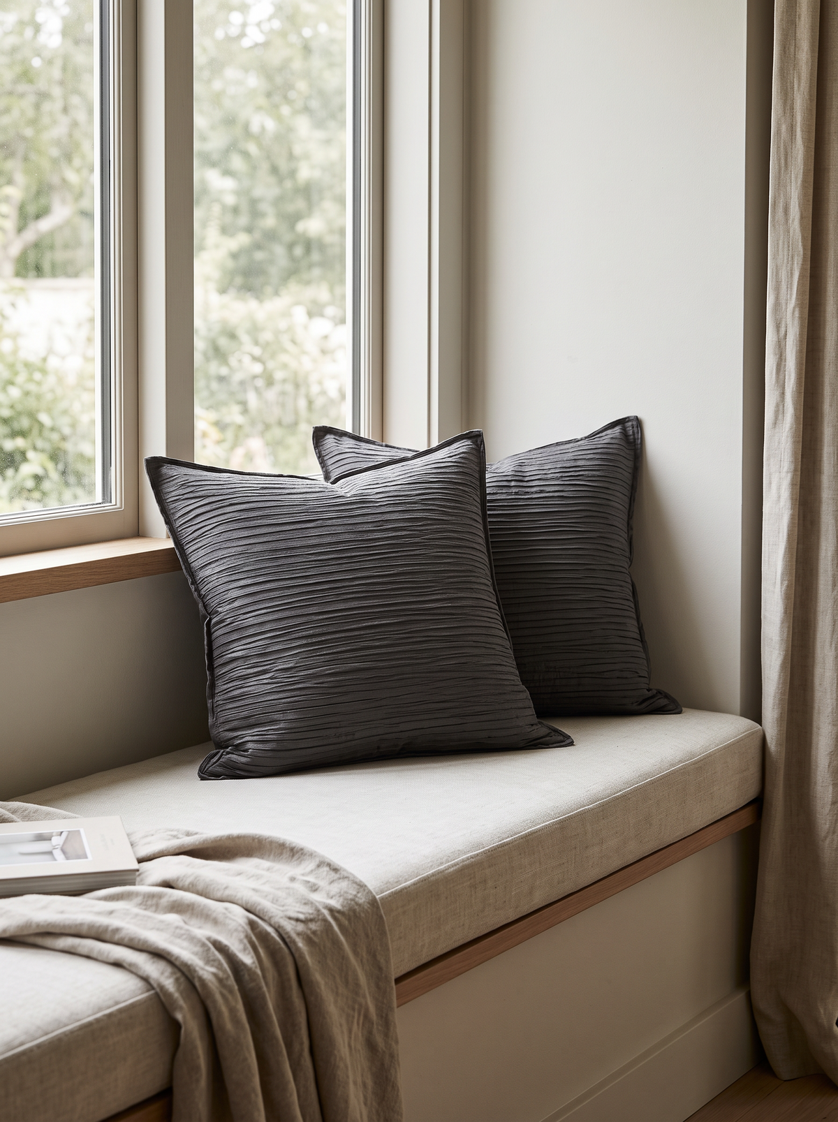 Ribbed Jacquard Cotton Cushion Covers in Dark Grey, styled at home on a window seat