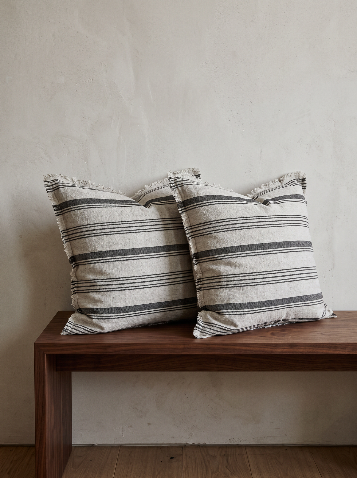 Fringed Stripe Linen Viscose Cushion Covers in White & Grey, styled at home on a walnut bench