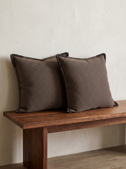 Chocolate Check Jacquard Cushion Covers, styled at home on a walnut bench
