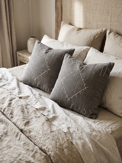 Grey Diamond Embroidery Cushion Covers, styled at home on a made bed