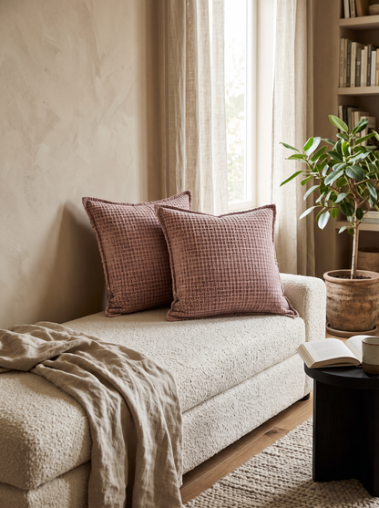 Rose Jacquard Cushion Covers, styled at home on a bouclé daybed