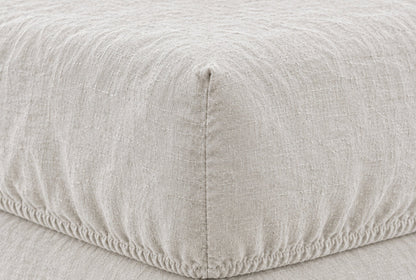 Macro of the elasticated corner and stitched seam of a Snow French linen fitted sheet on a mattress