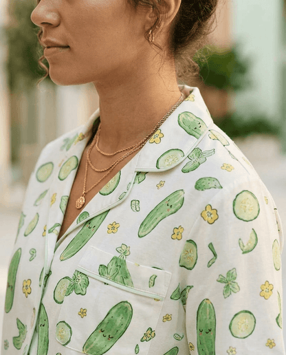 Person wearing a shirt with cucumber pattern outdoors