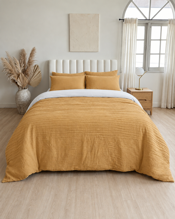 Mustard duvet cover with off white reverse, off white fitted sheet and mustard pillowcases in Cloud Cotton