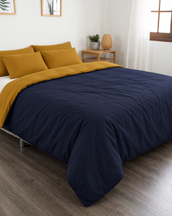 Navy Blue duvet cover with mustard reverse, off white fitted sheet and mustard pillowcases in Plain Cotton