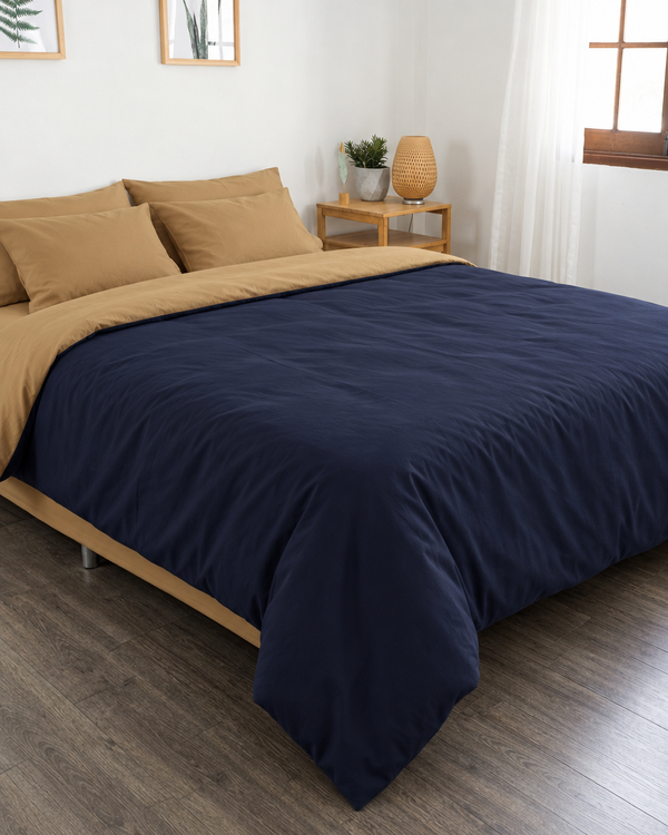 Navy Blue duvet cover with sand reverse, sand fitted sheet and sand pillowcases in Plain Cotton