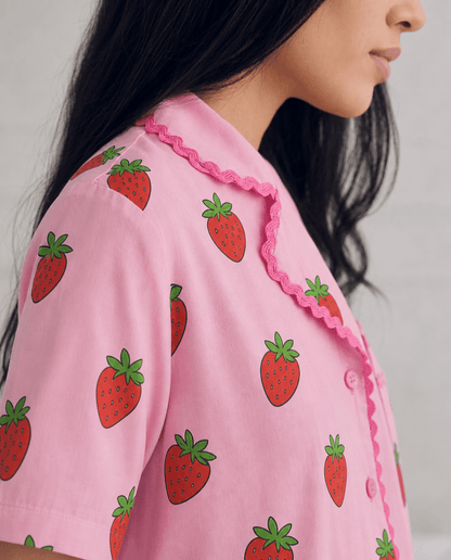 Close view of the Sweet Strawberry pyjama top and scalloped trim.