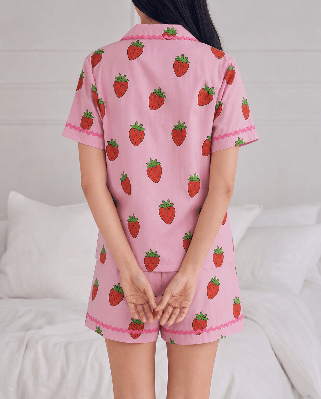 Sweet Strawberry Modal Cloud short pyjama set worn beside a bed.
