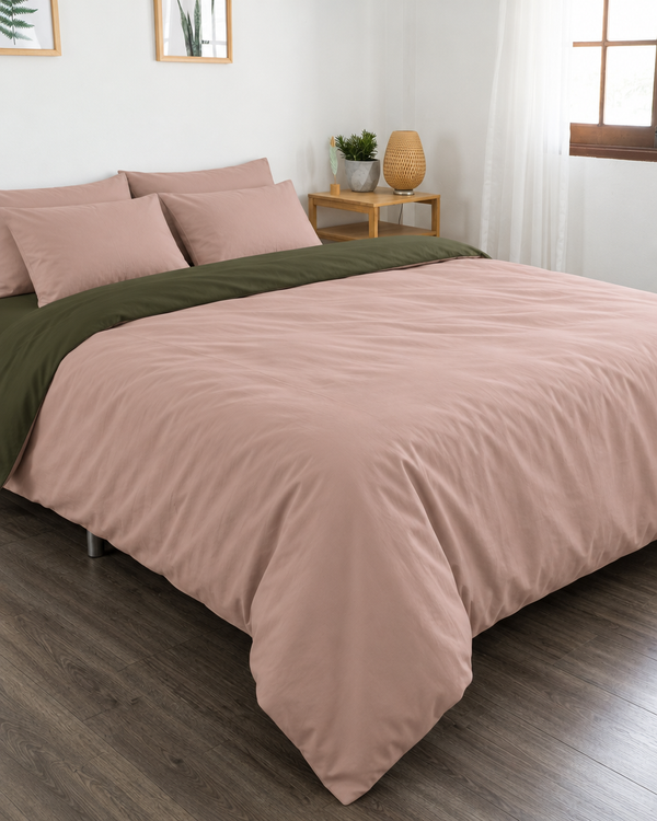 Pale Pink duvet cover with forest green reverse, forest green fitted sheet and pale pink pillowcases in Plain Cotton