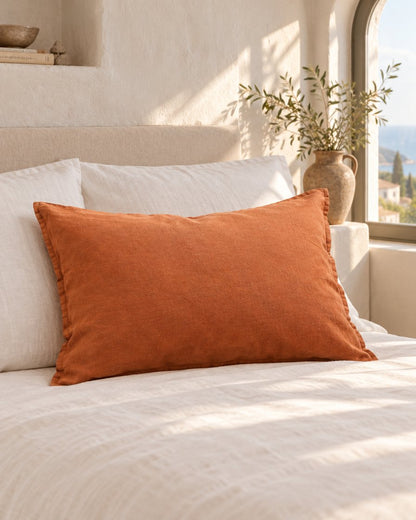 Terracotta French linen pillowcase, styled in a sun-washed Mediterranean bedroom