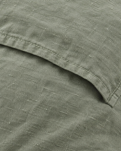 Close-up of stitched envelope opening hem of the pillowcase in Sage Linen