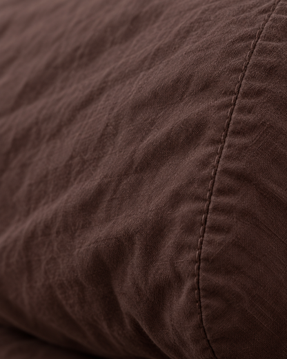 Macro of the stitched seam on a Chocolate pillow in plain cotton pillowcases.