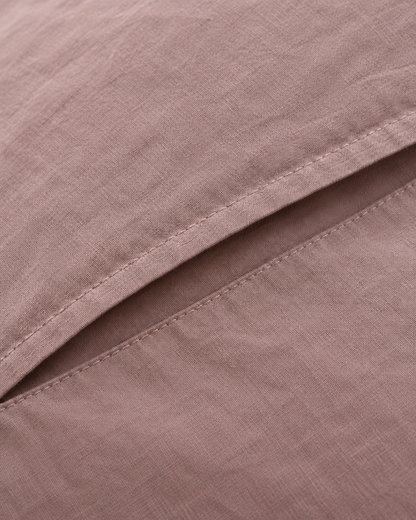 Close-up of stitched envelope opening hem of the pillowcase in Dust Pink Plain Cotton