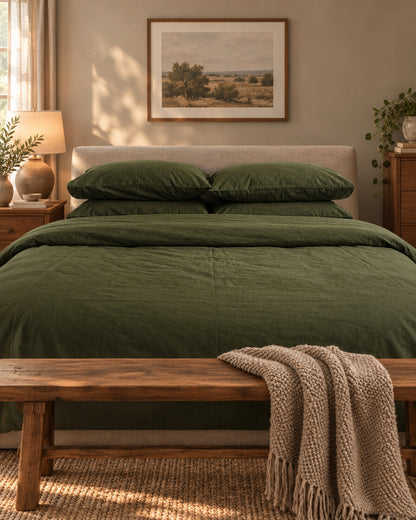 Olive green plain cotton pillows and duvet, styled in a cosy contemporary bedroom
