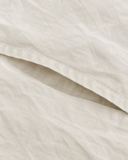 Close-up of stitched envelope opening hem of the pillowcase in Off White Plain Cotton