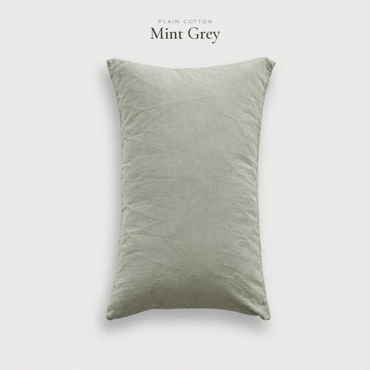 Mint Grey Plain Cotton pillowcase in a light grey-green washed cotton, studio shot