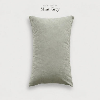Mint Grey Plain Cotton pillowcase in a light grey-green washed cotton, studio shot