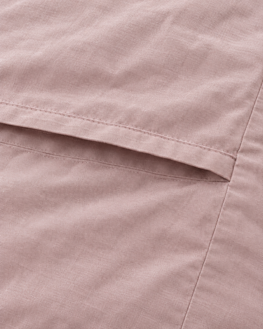 Close-up of stitched envelope opening hem of the pillowcase in Pale Pink Plain Cotton