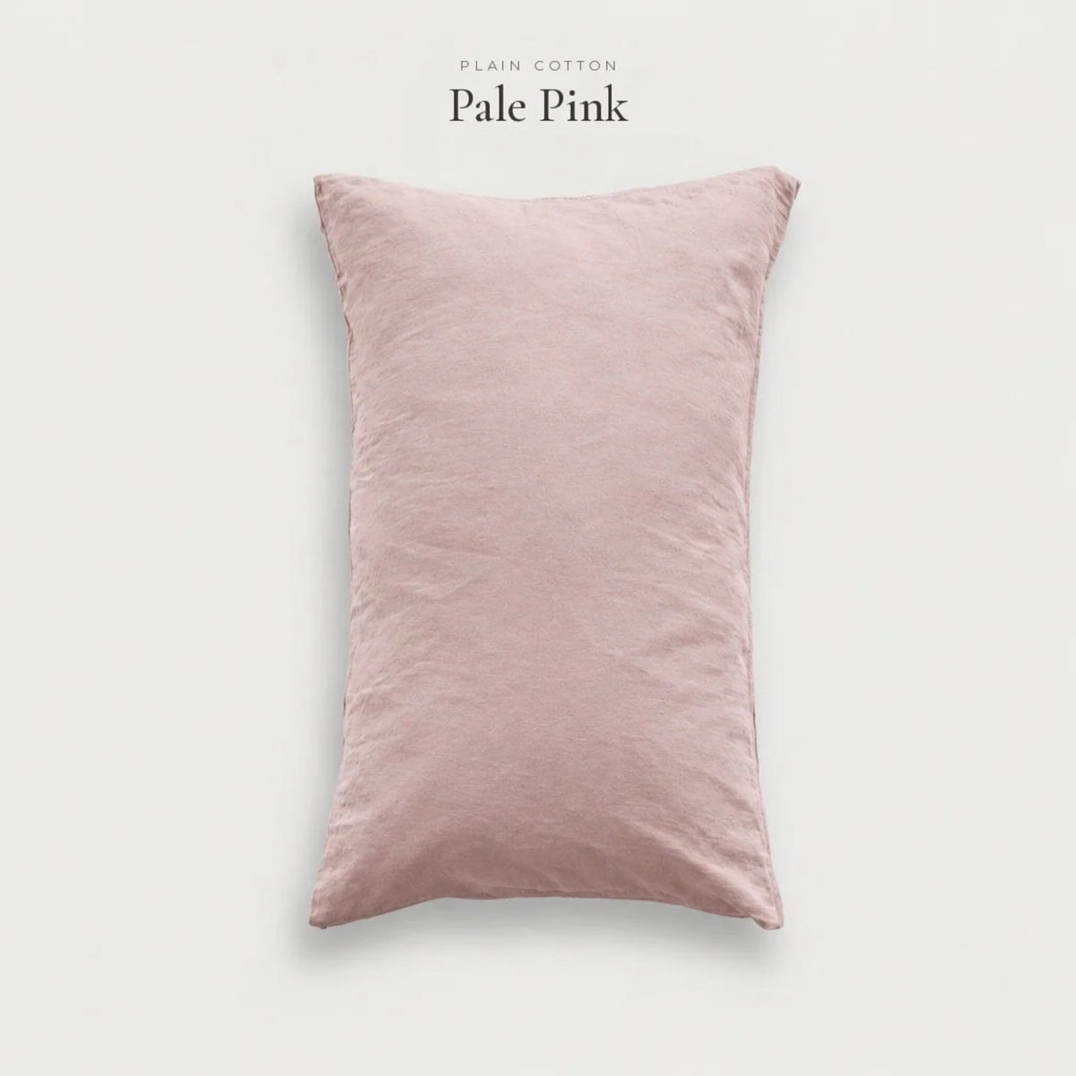 Pale Pink blush Plain Cotton pillowcase standing upright, studio shot
